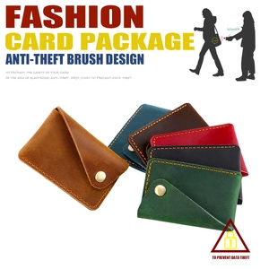 Detail view of handmade leather card holders with RFID protection and yellow stitching