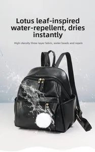 Detail view of black faux leather backpack with waterproof high-density fabric and side pocket
