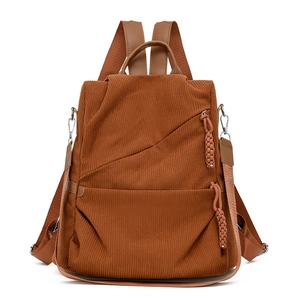 Brown corduroy multifunctional backpack with adjustable straps and front zip pockets