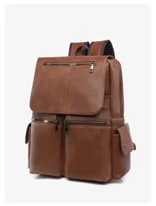 Detailed close-up of a vintage brown leather backpack with premium metal zippers and pockets