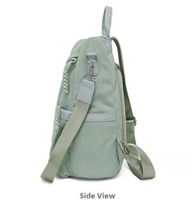 Side view of sage green corduroy backpack showing textured fabric and silver hardware