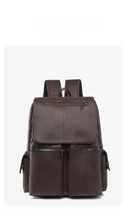 Detailed front view of coffee brown faux leather business backpack with zipper pockets