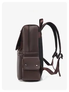 Side view of dark brown business backpack with side flap pocket and padded shoulder straps