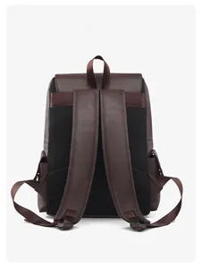 Detailed back view of a dark brown faux leather backpack with breathable black mesh padding
