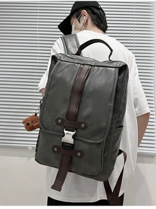 Men's retro PU leather laptop backpack featuring flap design and plush bear charm detail
