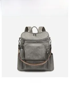 Front view of grey PU leather backpack featuring multi-pockets and woven strap detail