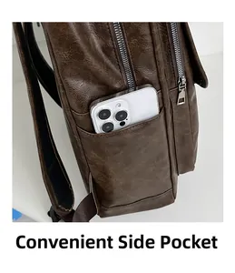 Close-up of the side pocket on a vintage brown PU leather backpack with a smartphone