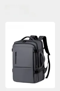 Detail view of the gray travel backpack showing buckle and multi-layer zippers