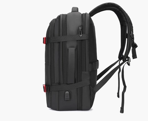 Side view of business backpack featuring built-in USB charging port and red buckle accents