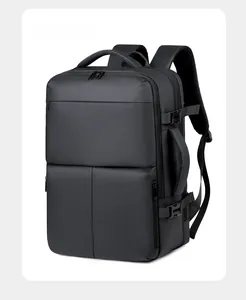 Close-up of black waterproof business travel backpack with side handle and side compression buckles