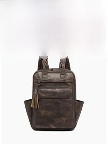 Front view of a brown vintage PU leather backpack with tassel detail and large capacity