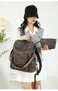 Deep brown PU leather backpack set with multi-zipper pockets and matching small pouch