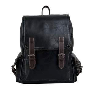 Classic retro PU leather backpack in black featuring brown straps and metal buckles