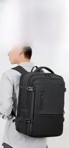 Close-up of black travel backpack showing water-resistant fabric and buckle straps