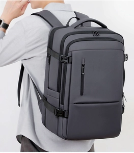 Detailed side view of large travel backpack showing buckles and thick shoulder straps