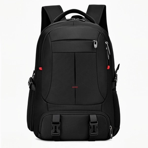 Large black travel backpack with waterproof nylon, multiple pockets, and red stitching detail
