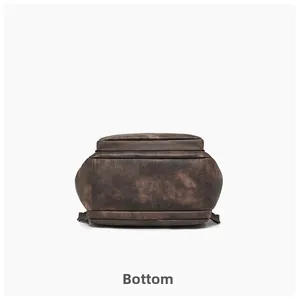 Bottom view of vintage brown PU leather backpack showing durable stitching and texture