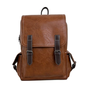 Brown vintage PU leather backpack with contrast stitching and decorative belt buckles