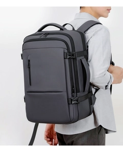 Ergonomic deep grey business travel backpack with thick waterproof fabric and multiple compartments