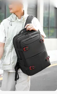 Detailed view of high-capacity black business backpack with functional buckles and compartments