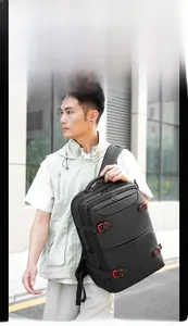 Close-up of a black waterproof business travel backpack with stylish red buckles