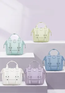 Front detail of five colorful multifunctional oxford pet bags with leather buckle straps