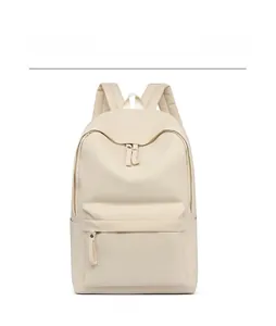 Front view of a minimalist beige oxford fabric backpack with a zippered front pocket