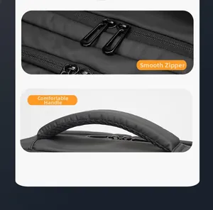 Detail of smooth double metal zippers and reinforced padded handle on black business backpack