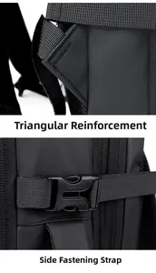 Detail view of reinforced stitching on shoulder straps and side buckle of black travel backpack
