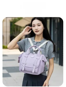 Outdoor model display of a lavender waterproof nylon multi-functional mommy backpack