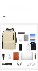 Compartiments internes du sac à dos de voyage beige avec ordinateur et accessoires