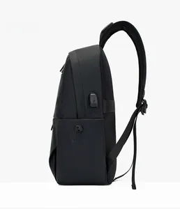 Business laptop backpack detail showing integrated USB charging port and side elastic pocket