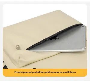 Gros plan du compartiment avant zippé montrant le rangement rapide pour une tablette