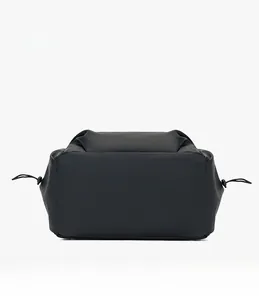 Detail view of the large capacity backpack bottom with durable scratch-resistant fabric