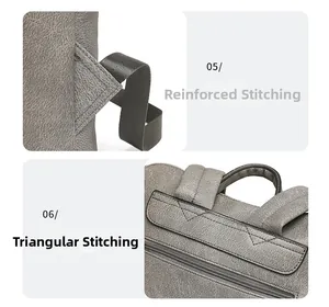 Detail view of reinforced bar-tack stitching and triangular seams on grey leather backpack
