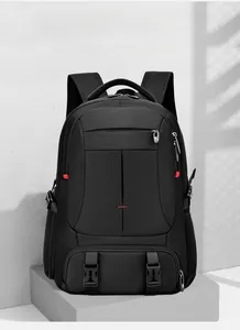 Detail of multi-compartment black travel backpack with side straps and bottom buckles