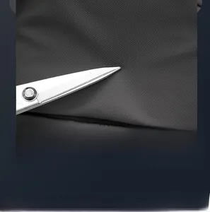 Close-up of high-density scratch-resistant fabric on business backpack surface