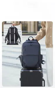 Business backpack with luggage strap showing attachment to a suitcase handle