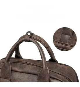 Detail of brown PU leather backpack handle with reinforced metal rivets and stitching
