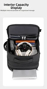 Detailed interior view of a black travel backpack showing multi-compartment storage space