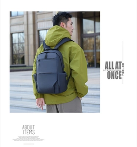 Man wearing a black business backpack on the street with a matte scratch-resistant finish