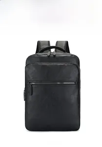 Front view of black PU leather backpack showing fine lychee texture and dual zippers