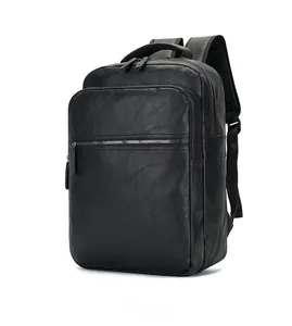 Detail view of black PU leather business backpack with lychee grain and metal zipper