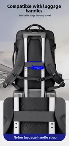 Detail of travel backpack with trolley sleeve attached to a silver suitcase handle