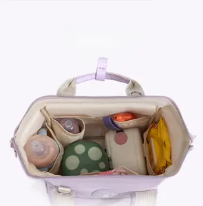 Interior view showing functional compartments and large capacity of the diaper backpack