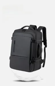 Detailed side view of black lightweight business travel backpack showing handle and compression straps