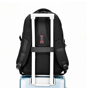 Detail of breathable mesh back panel and trolley strap on large black travel backpack
