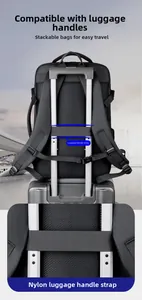 Detail of travel backpack trolley strap attached to a suitcase handle with reinforced stitching