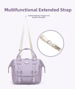 Detail view of the lavender diaper bag showing adjustable straps for shoulder or backpack use