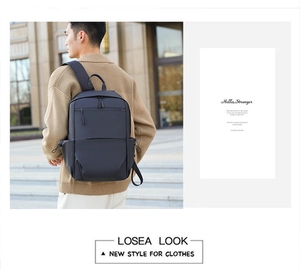 Minimalist waterproof business laptop backpack with side drawstring pocket on male model